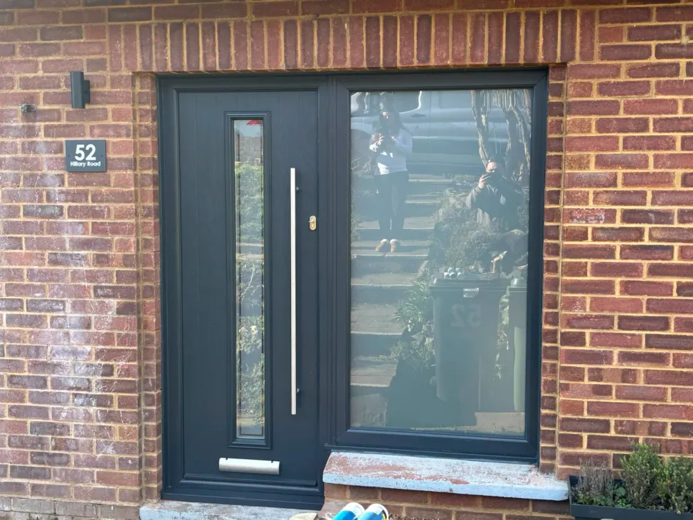 Anthracite composite front door with a full-height glazed side panel