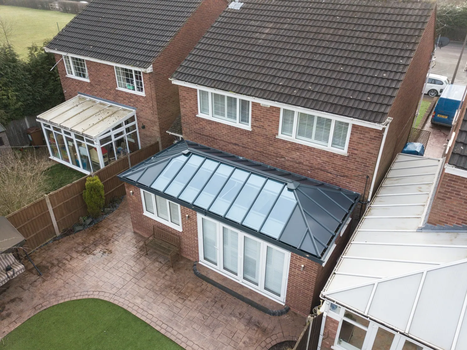 Hybrid roof extension with solid and glazed sections