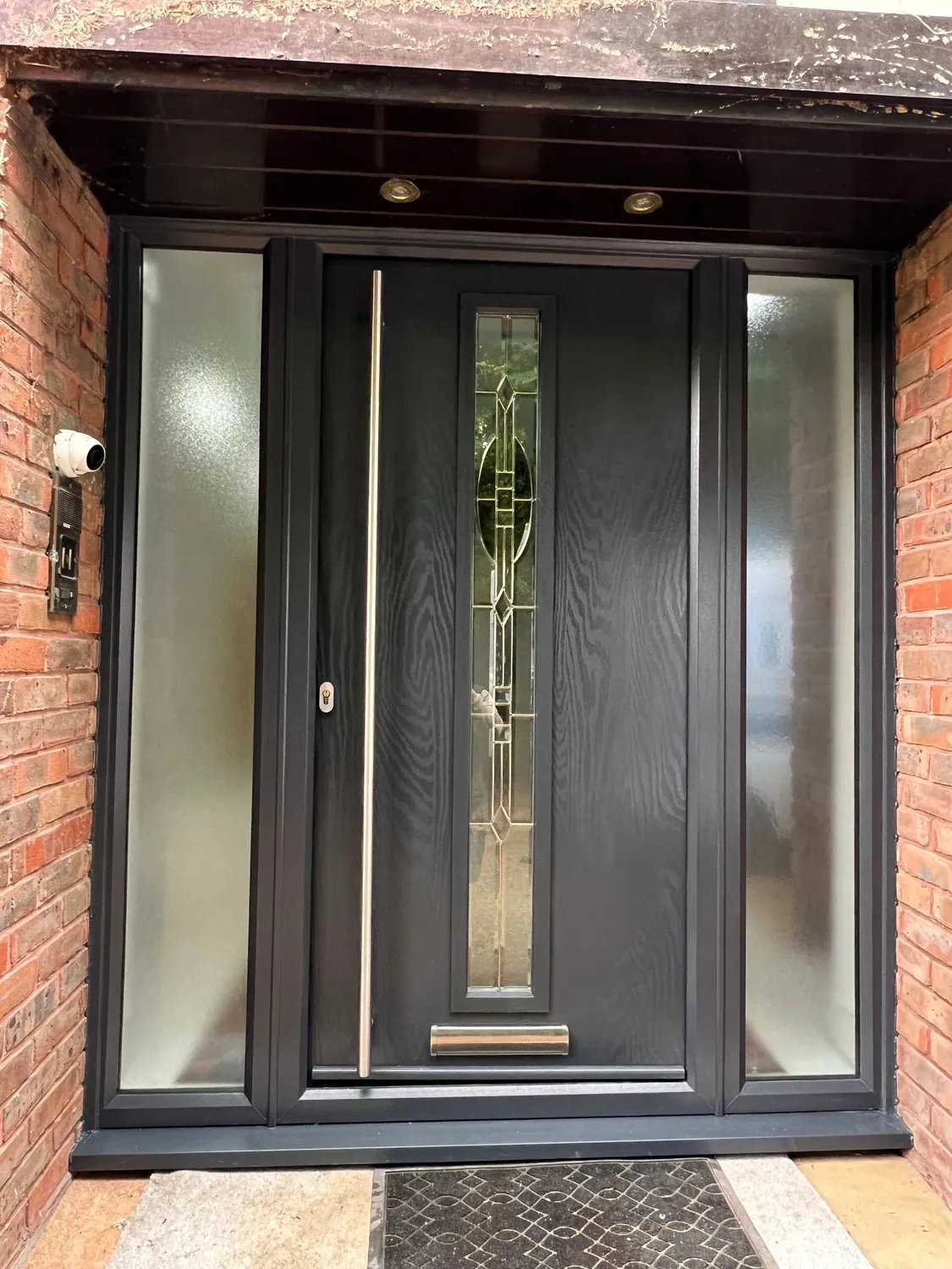 Anthracite composite front door with decorative glazing and matching glazed side panels